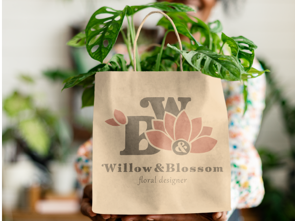 Willow & Blossom floral designer brand identity on a kraft paper shopping bag