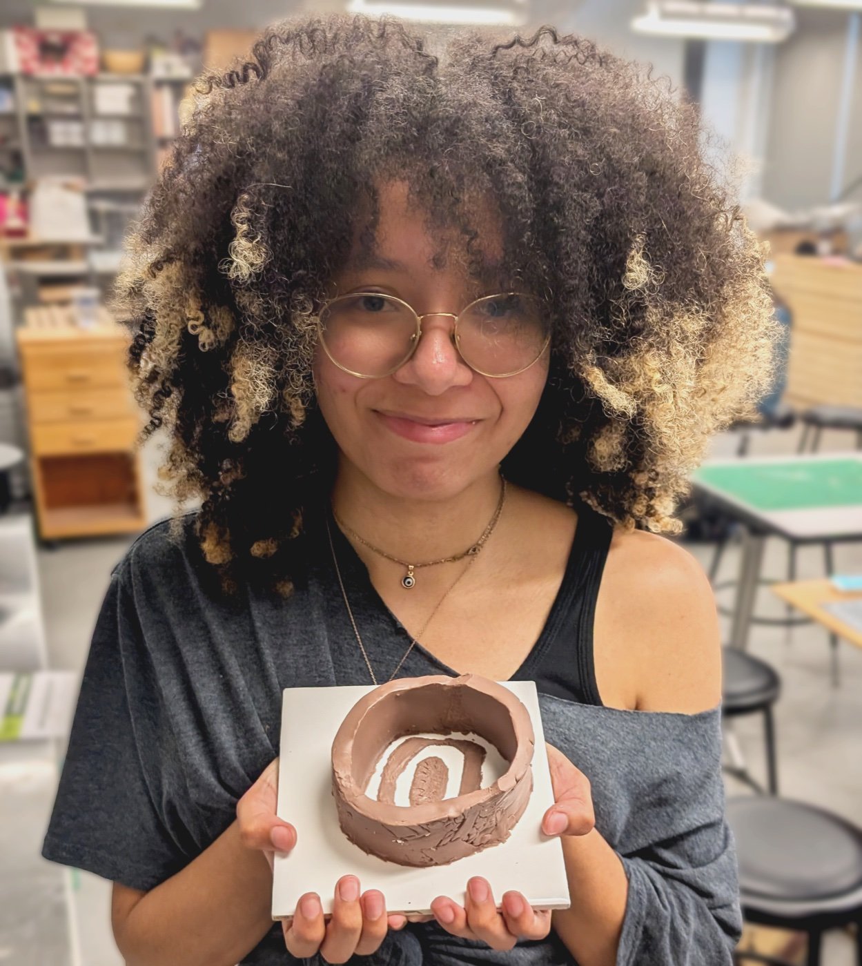 Naomi Davis holding one of her practical-effects pieces